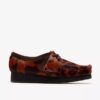 Wallabee voor dames. Bruine Wallabees met koeienprint