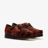Wallabee voor dames. Bruine Wallabees met koeienprint