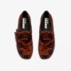 Wallabee voor dames. Bruine Wallabees met koeienprint